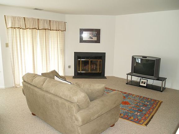 Living Room w/ woodburning fireplace