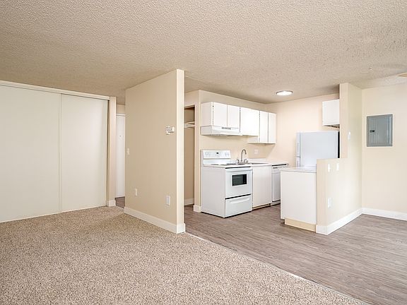 Sunset Apartments | Living Area + Balcony