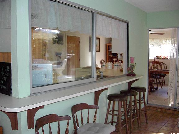 Kitchen Bar overlooking the back deck and screened in pool