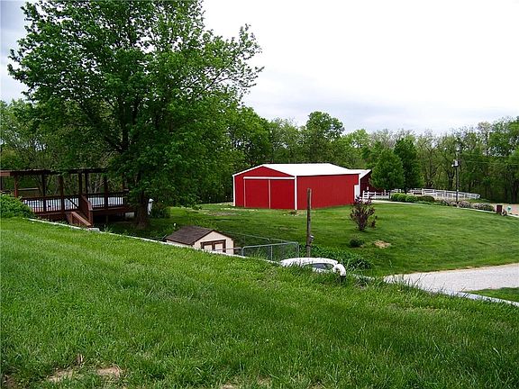 View from roof to pool, deck and outbuildings.