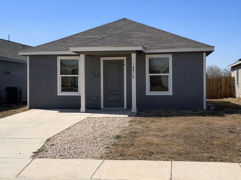 Front of house with driveway extension