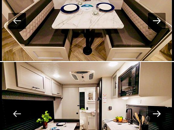 The booth with storage under the seats and nice window shown here with shades pulled. The photo underneath shows a full view from the sofa , through the kitchen and table all the way to the entrance of the bathroom which the door is open in this photo so