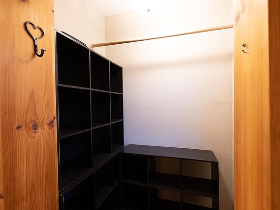 Coat/storage closet at top of stairs