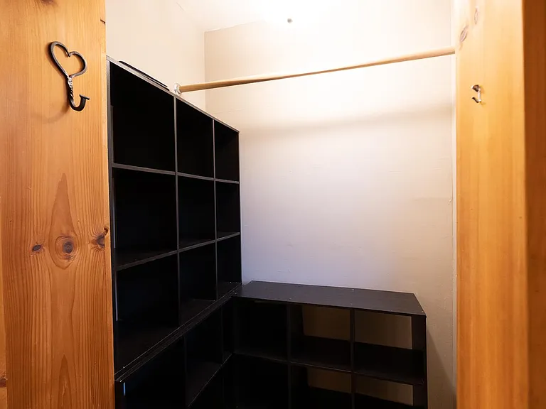Coat/storage closet at top of stairs
