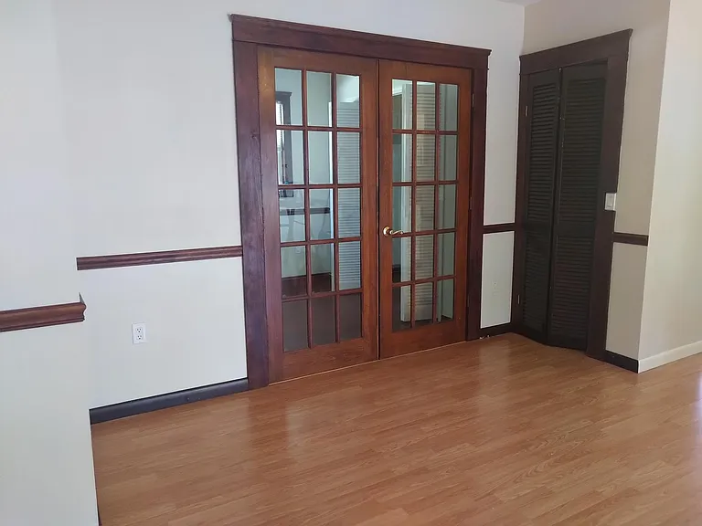 French doors leading to bedroom the main bedroom.