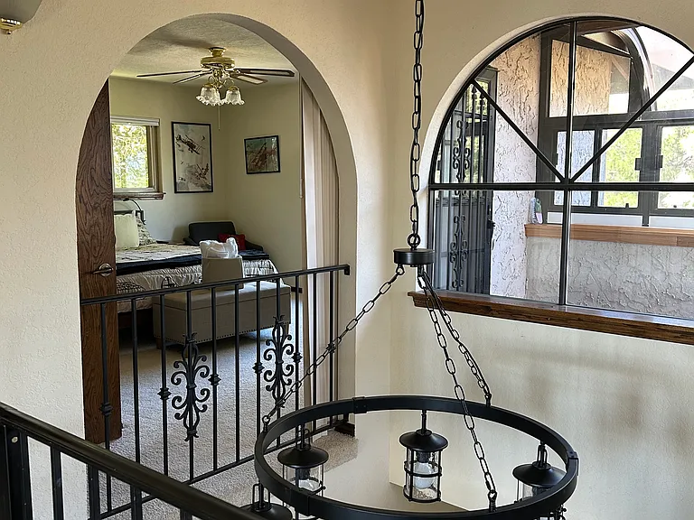 With the vertical shades open, the third bedroom can be seen from the landing.