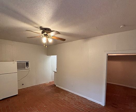 living area looking toward kitchen and bedroom