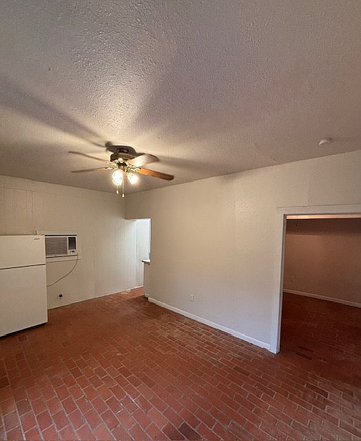 living area looking toward kitchen and bedroom