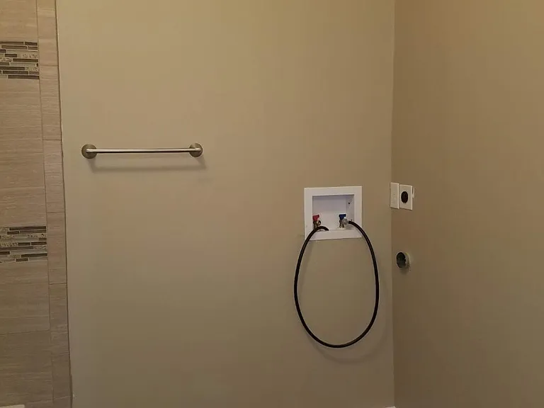 Bathroom with washer and dryer hookups
