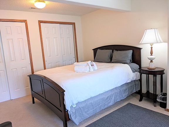 Queen-size bed, night stand and lamp