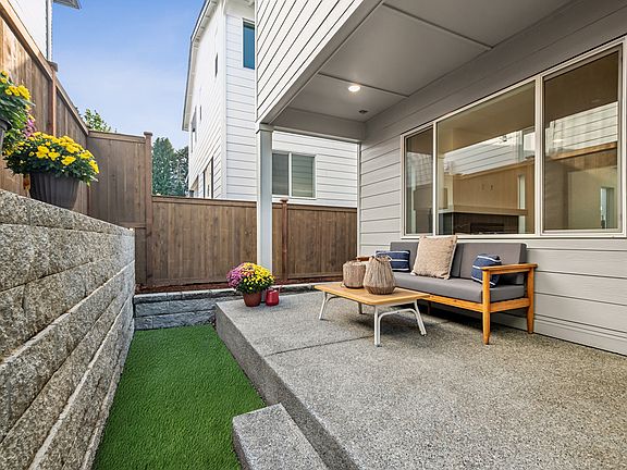 Covered Rear Patio and Fenced Rear Yard with Turf