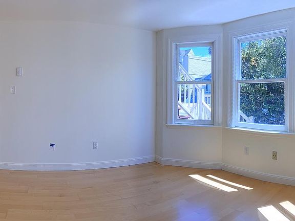From the Living Room looking into the front entrance and the Dining Room / Front Bedroom