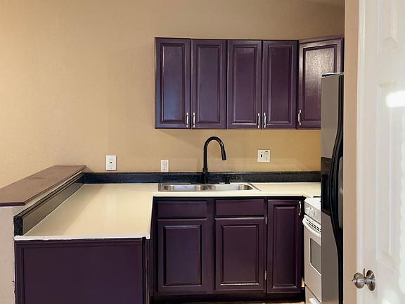 Kitchen with stove, microwave, and refrigerator included
