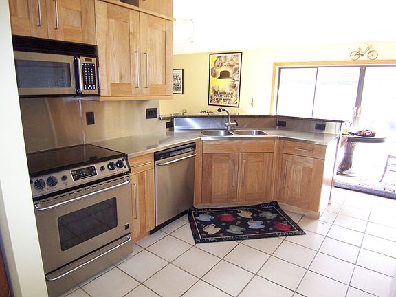 Stainless  counters, kitchen overlooking pool