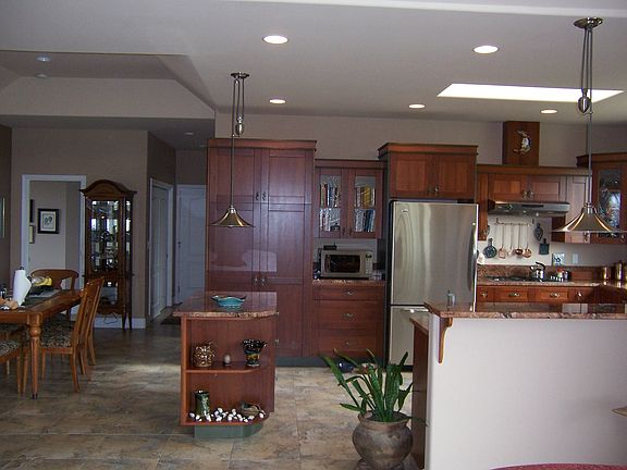 Note the coffered ceiling over the dining area and the recessed lighting. The generous use of skylig