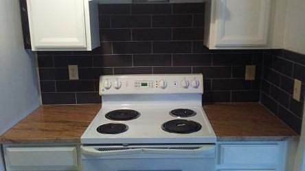 Stove with granite counters....stove handle has been replaced.