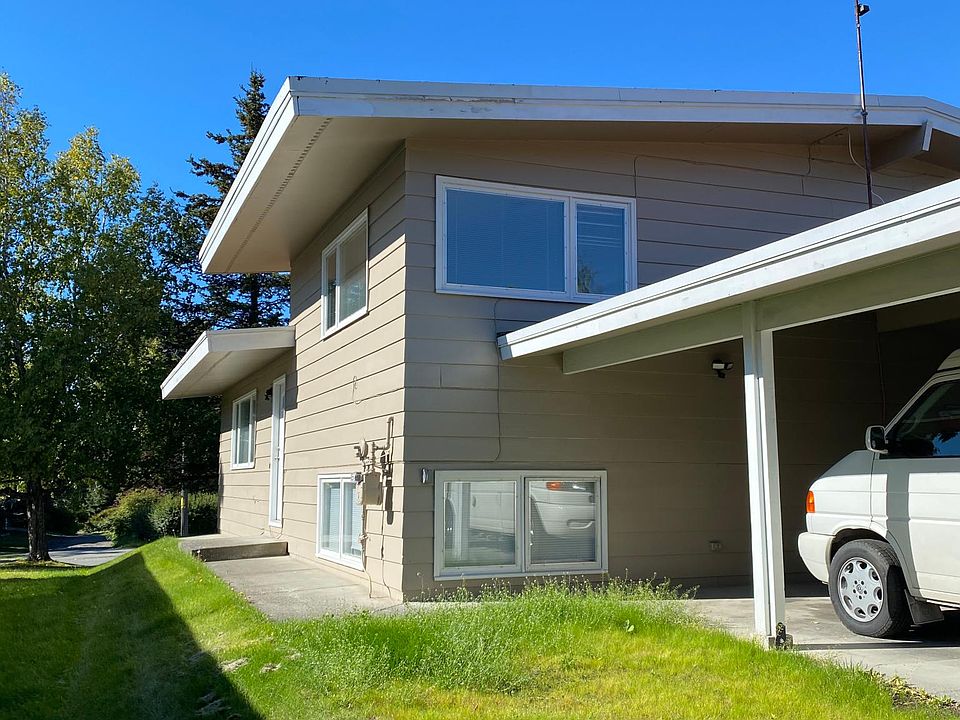 View from the alley. Southside house entrance. The living room is on the main level and the 2 bedrooms are on the upper level.