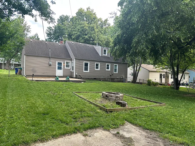 Large yard with patio and fire pit