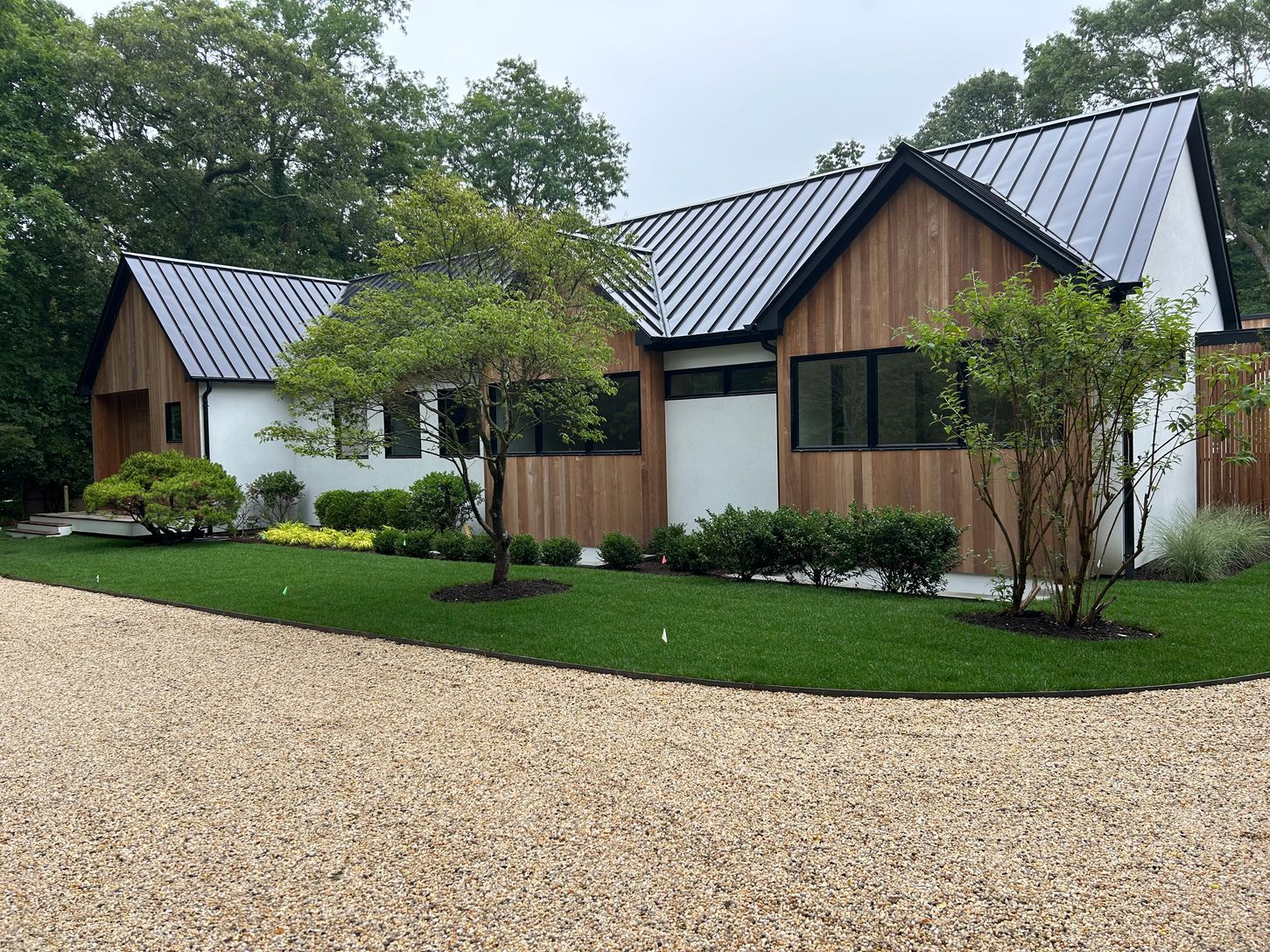  Modern Farm House with mahogany, stucco and steel accents, circular driveway, mature landscaping