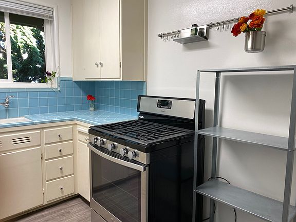 Kitchen appliances include stove, oven, microwave and refrigerator (no dishwasher).