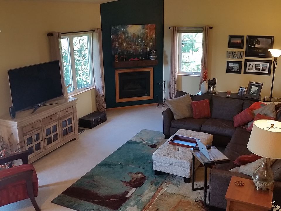 Great Room with gas fireplace and vaulted ceiling