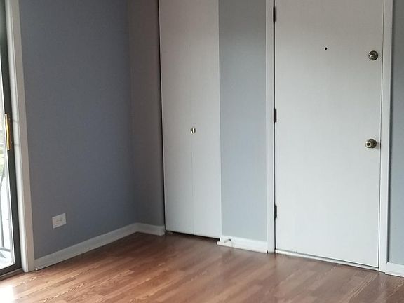 Living room with coat closet and front door
