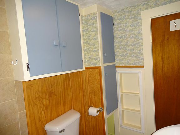 Bath has great storage, (cabinets & built in shelving) beautiful wainscotting!