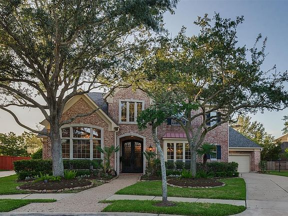 Rich in Character this Peterson Custom Homes boasts an elegant and custom upscale Elevation with a Side Drive Way and Garages that are set back from the home. You see immediately that the owners of this home have taken great price in their landscapin