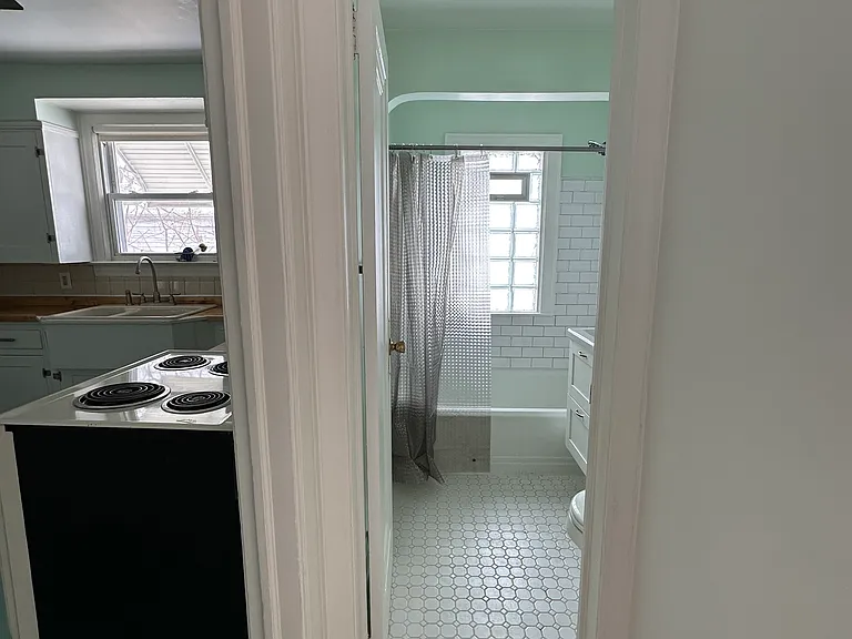 hall entryways to kitchen and bathroom