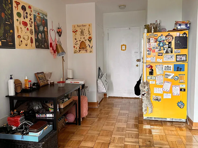 Facing the front door of apartment as decorated by a past tenant. (Not the present location of the refrigerator.)