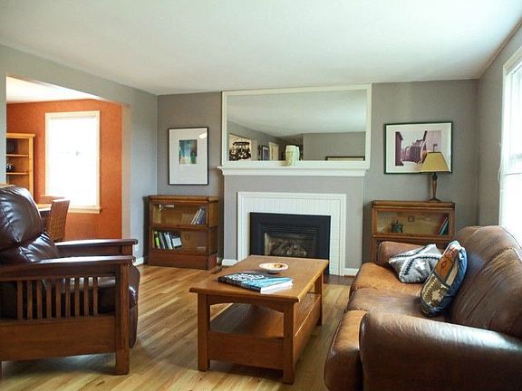 Gleaming hardwoods and a gas fireplace lend warmth to the living room. Large windows and Western exposure bring in lots of light even on rainy days.