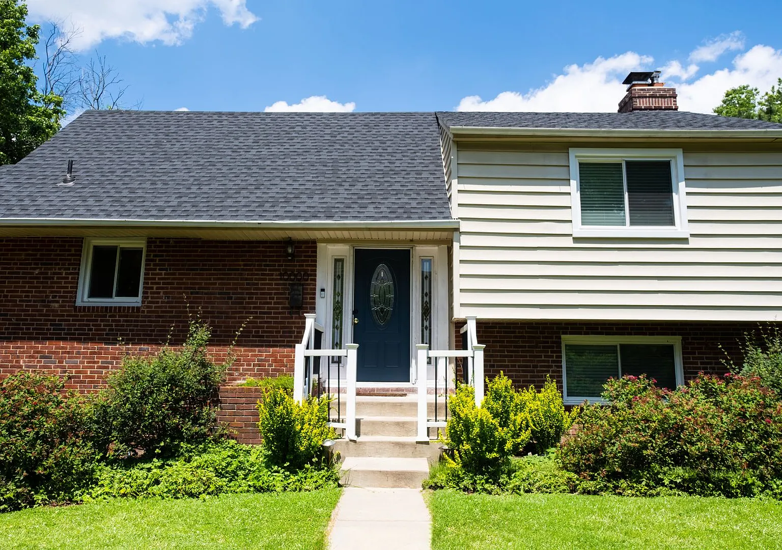 Charming Split-Level Home with Bright Interiors and Spacious Backyard — Photo 1