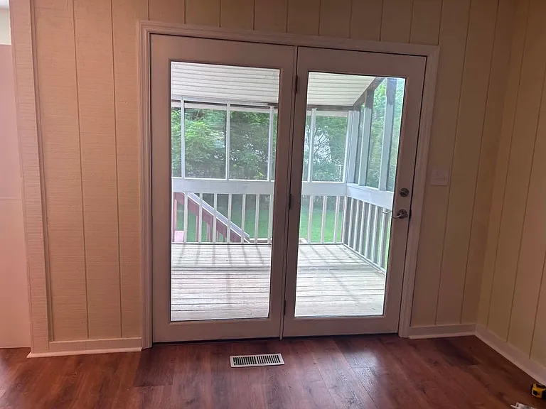 view of screened in porch from dining area