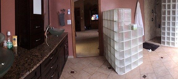 Palatial Master Bath
						:
						Spacious glass block shower,granite counter,heated floor,and glass double sinks.