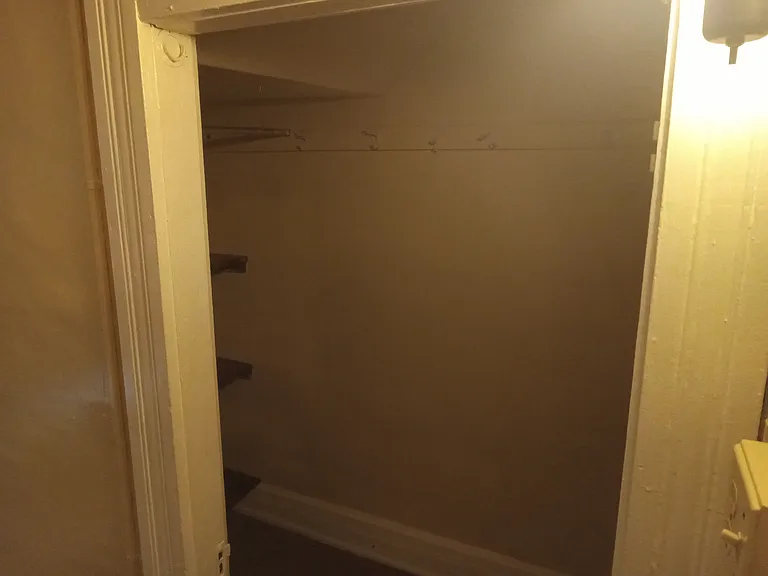 Bedroom #1 to the right leading into walk-in closet