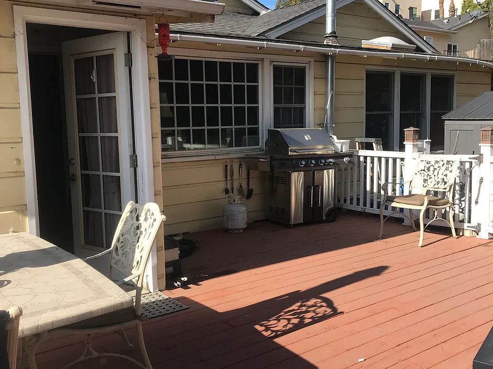 Nice Roomy Deck for extra outdoor living space and entertaining. This is the entrance closest to the private driveway.