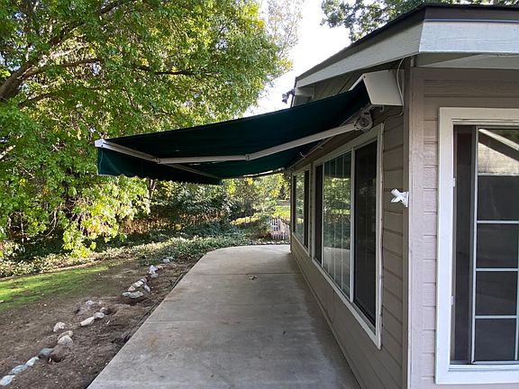 Porch area with retractable awning open