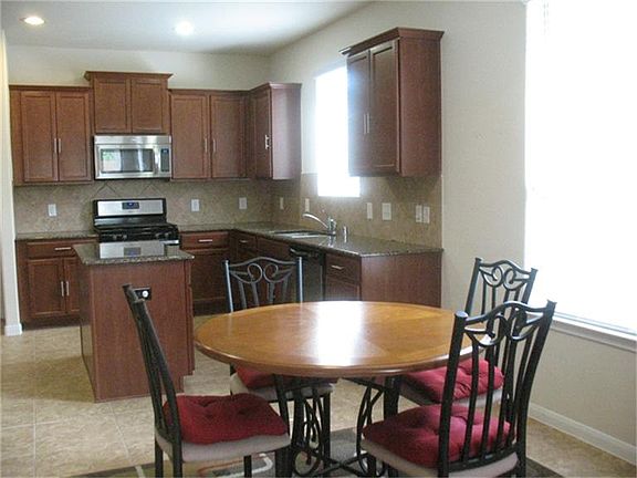 Very open spaces kitchen, dining, and living
