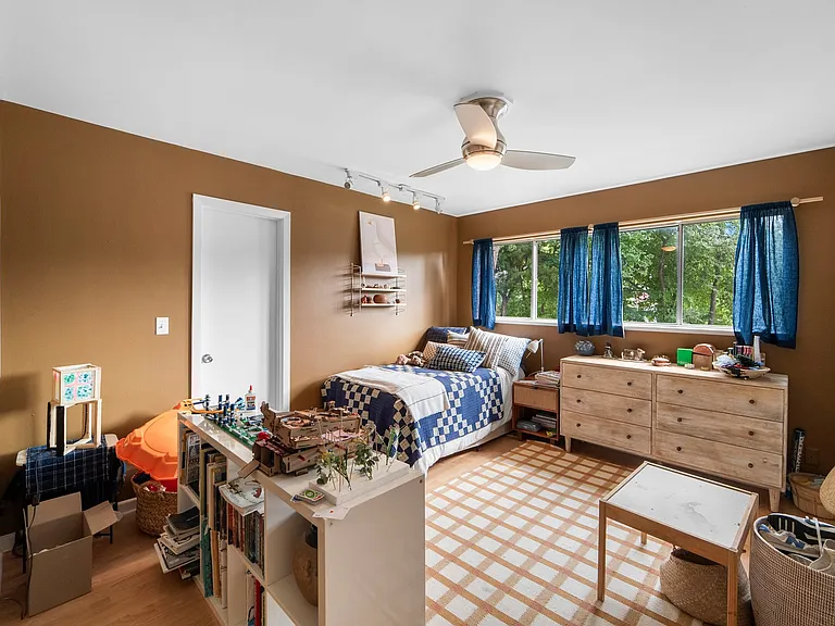 Second bedroom. Two reach-in closets to right. Door in back to Jack n Jill bath