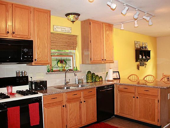 The kitchen has lots of counter and cabinet space, and a giant pantry.