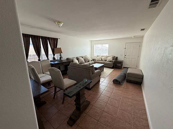 Large living room and dining room combination. (Tenant in process of moving.)