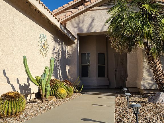 Main Entrance with pretty plants and solar powered outdoors lights