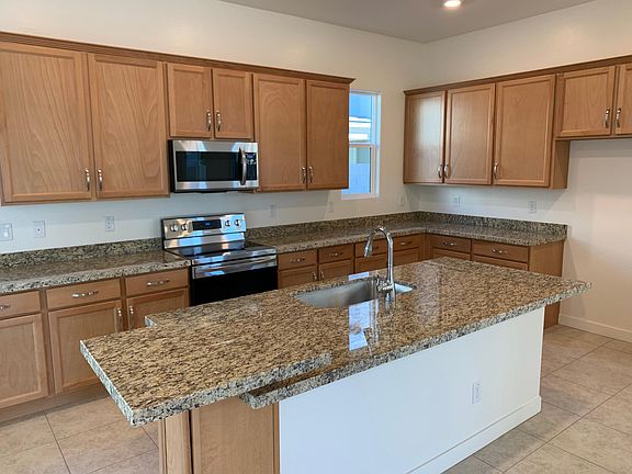 Granite countertop kitchen with extra large island and bar top!