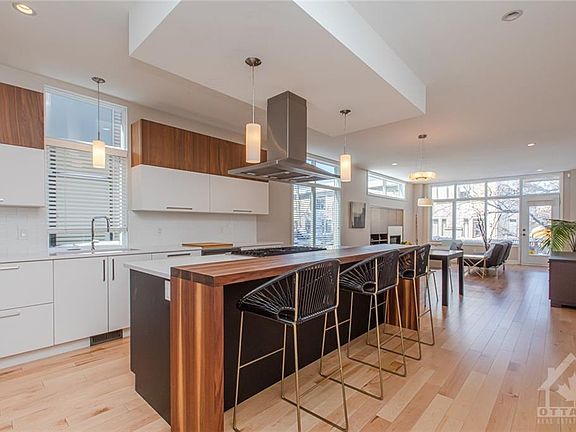 Kitchen with walnut accents and quartz counters