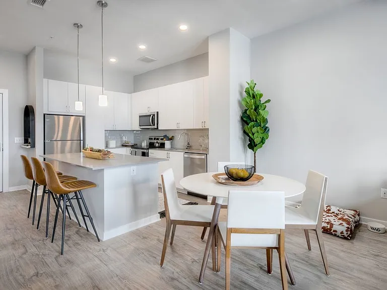 Scheme 1 kitchen with quartz countertops, tile backsplash, stainless steel appliances and hard surface flooring