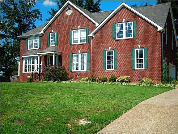 Pea gravel driveway and three car garage make this home even more appealing.