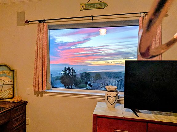 Picture taken from window of room for rent. TV and desk