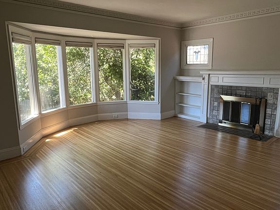Living room with bay window and fireplace