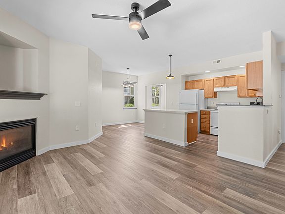 Well-maintained unit with LVP flooring, updated appliances and lighting throughout