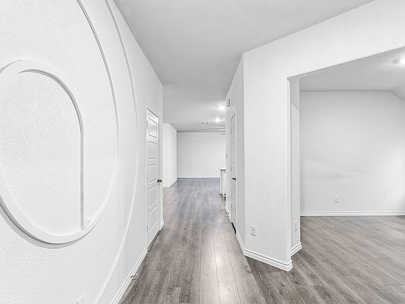 This LED accent wall LIGHTS UP
 Dedicated home office to your right.